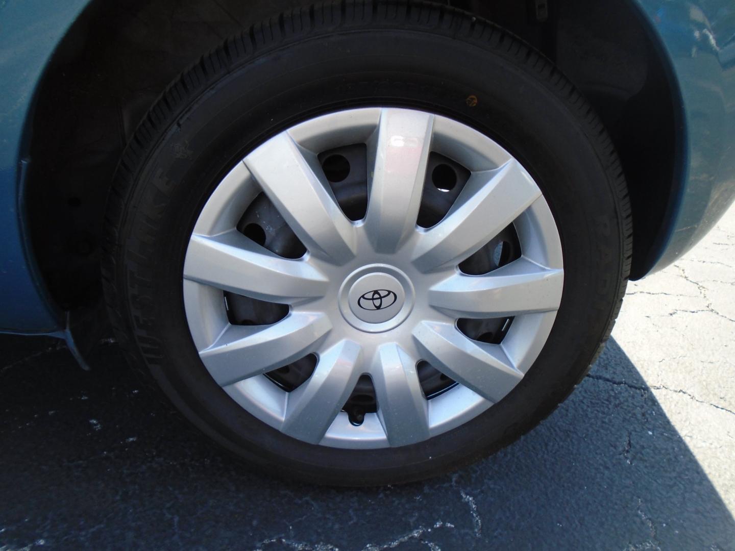 2010 BLUE /Grey Toyota Yaris Liftback 5-Door AT (JTDKT4K39A5) with an 1.5L L4 DOHC 16V engine, 4-Speed Automatic transmission, located at 6112 N Florida Avenue, Tampa, FL, 33604, (888) 521-5131, 27.954929, -82.459534 - Photo#5